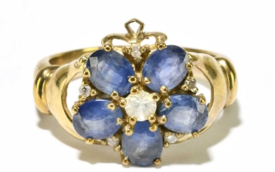 A 9ct yellow gold diamond and pale blue stone floral...
