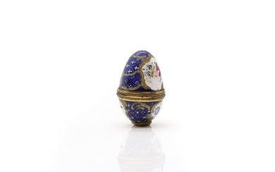 A Bilston enamel egg-shaped nutmeg grater