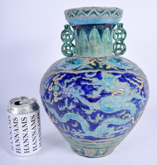 A CHINESE TWIN HANDLED PORCELAIN VASE 20th Century. 30
