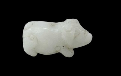 A Chinese carved white hardstone figure of a pig, height...
