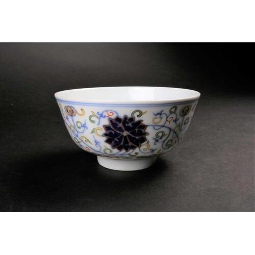 A Chinese doucai Lotus bowl, painted with blue lotus flowers...