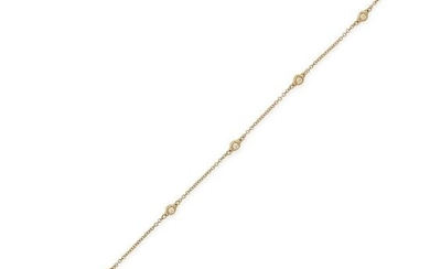 A DIAMOND BRACELET in 18ct yellow gold, the trace chain set with five round brilliant cut diamonds