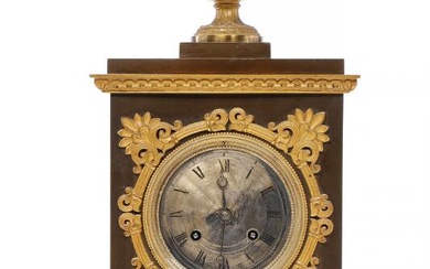 A French late empire mantel clock. Early 19th century. H. 43 cm....