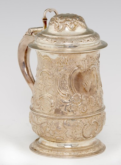 A GEORGE III SILVER TANKARD later chased and engraved with ...