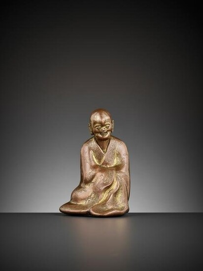 A GILT COPPER ALLOY FIGURE OF A LUOHAN, 17TH CENTURY