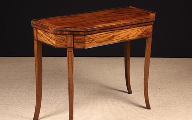 A George IV Style Inlaid Mahogany Card Table. The canted top with cross-banded borders and inlaid st
