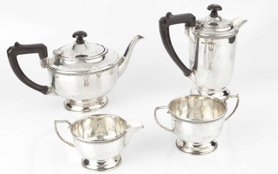 A George V silver four piece tea service, with gadrooned...