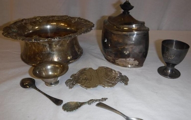 A George V silver tea caddy of oval form...