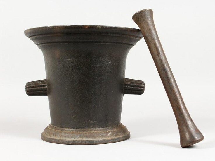 A LARGE CAST IRON PESTLE AND MORTAR. 8.5ins high.