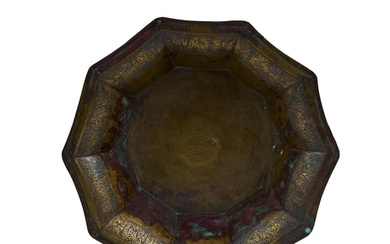 A LARGE KHORASSAN SILVER AND COPPER INLAID BRASS BASIN NORTH...
