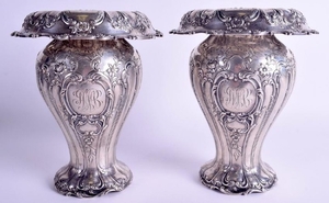 A PAIR OF ANTIQUE NEO CLASSICAL SILVER EMBOSSED VASES.