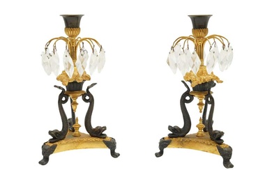 A PAIR OF FRENCH EMPIRE ORMOLU AND PATINATED BRONZE CANDLESTICKS