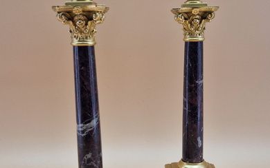 A PAIR OF RED MARBLE AND ORMOLU CANDLESTICKS, THE TWO HANDLED URN NOZZLES ABOVE CORINTHIAN CAPITALS
