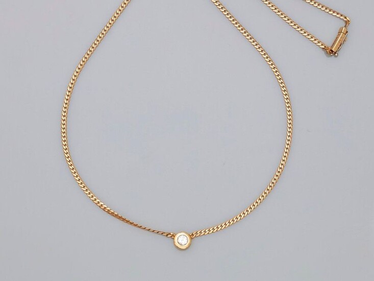 A. ROURE. Necklace in yellow gold, 750 MM, centered on a brilliant-cut diamond in a setting weighing 0.20 carat, signature on clasp, length 46 cm, eight security clasp, weight: 8.8gr. rough.