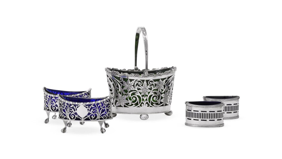 A SILVER PIERCED OVAL BASKET AND TWO PAIRS OF PIERCED SALT CELLARS