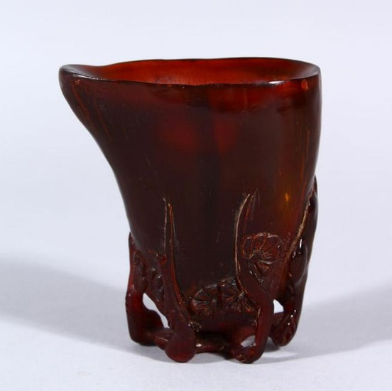 A SMALL CHINESE HORN LIBATION CUP, carved with lower