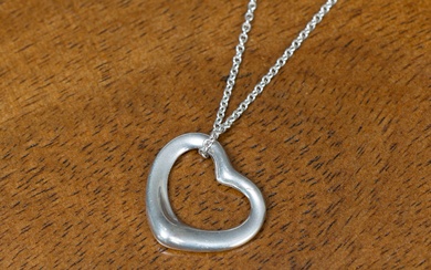 A Tiffany & Co sterling silver open heart pendant on chain, designed by Elsa Peretti, pendant width 24mm