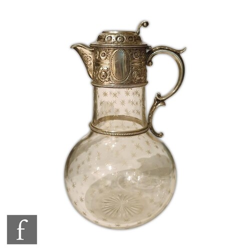 A Victorian hallmarked silver and clear glass claret jug the...