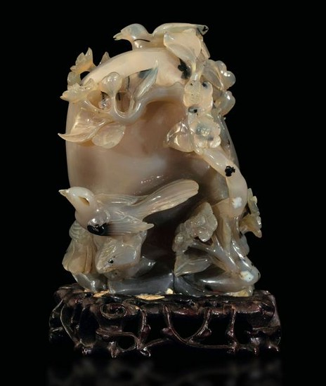 A carved agate group, China, 20th century