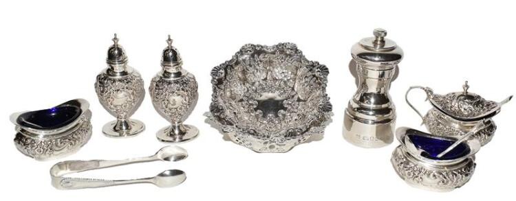 A collection of assorted silver, including: a five-piece condiment-set, each...