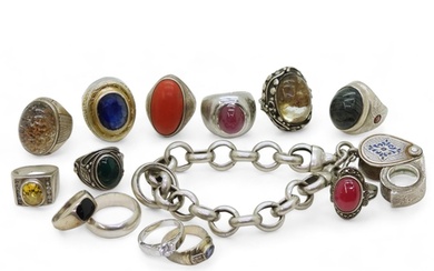 A collection of silver and white metal rings, to include tre...