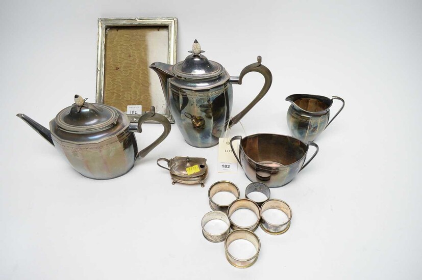 A four-piece electroplate tea service and a silver photograph frame