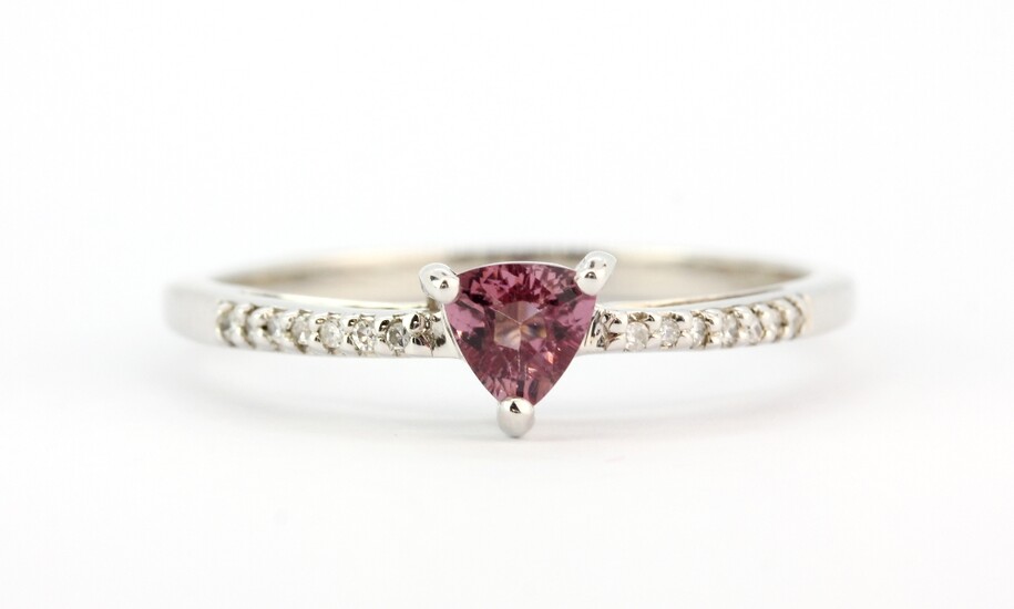 A hallmarked 9ct white gold ring set with a trillion cut pink tourmaline and diamond set shoulders, (W).