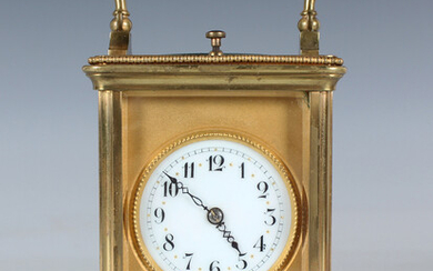 A late 19th century/early 20th century lacquered brass carriage clock with eight day movement striki
