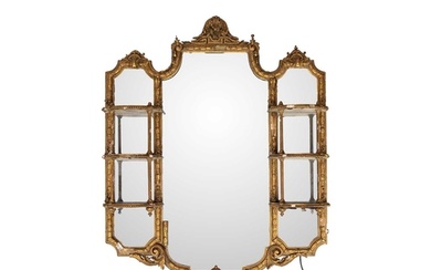A late Victorian gilt gesso wall mirror. The central plate f...