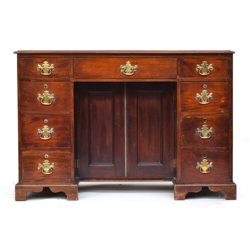 A mahogany ladies kneehole dressing table, moulded top over ...