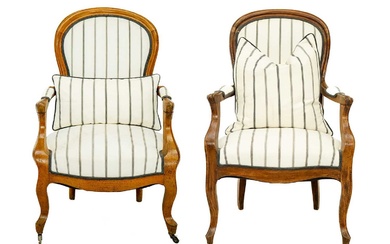 A matched pair of French walnut upholstered fauteuil armchairs.