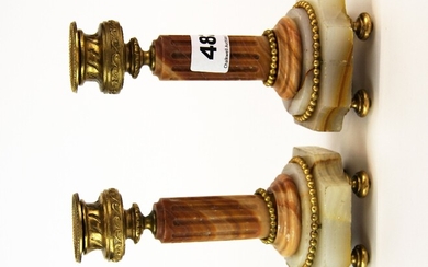 A pair of 19th century onyx and ormolu candlesticks, H. 16.5cm.