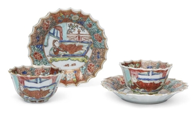 A pair of Chinese famille rose lobed 'foreigner' tea cups and saucers, Yongzheng period, all moulded as petals of a flower, the saucer painted to the central roundel with a reclining foreigner in red robe within a garden landscape, the cup with...