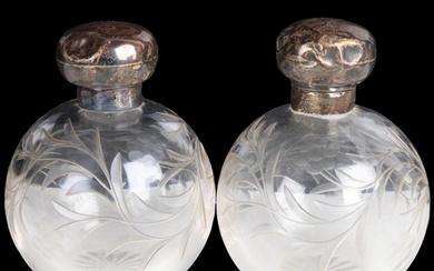 A pair of Edwardian silver-mounted glass globe dressing tabl...