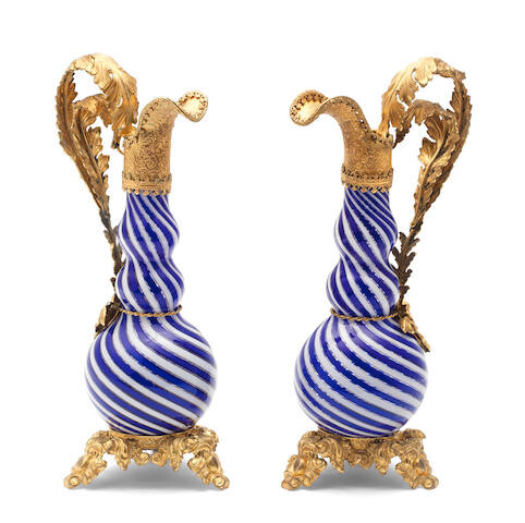 A pair of French gilt-metal mounted ewers, late 19th century