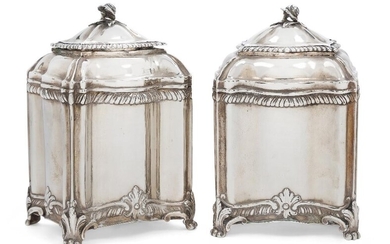 A pair of George II silver tea caddies, London, 1769, William Vincent, of shaped rectangular form and raised on four trefoil-shouldered paw feet , the lids with rosebud finials and gadrooned borders, 13cm high, total weight approx. 16oz (2)...