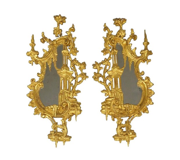 A pair of George III carved gilt wood wall mirrors, late 18th century, in the Rococo taste, with C scrolls and floral border, 80 x 37cm