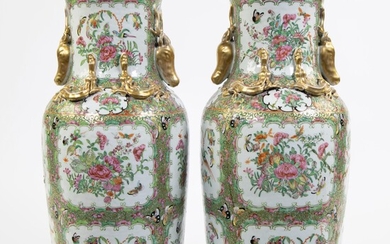 A pair of large Canton porcelain baluster vases, decorated in famille rose enamels with flowers and butterflies within cloud shaped cartouches. Finely sculpted deer heads to the colar. Painted gold, Chine, 19th century.