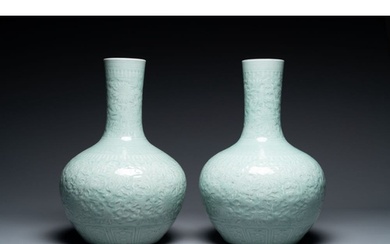 A pair of large Chinese monochrome celadon-glazed anhua 'lot...