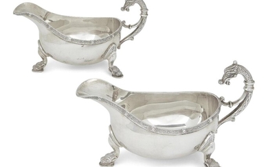 A pair of silver gravy boats with zoomorphic handles, Birmingham, 1972, Roberts & Dore, each designed with Neoclassical-style border and raised on three stylised zoomorphic feet, 10.4cm high, 17.5cm long (inc. handles), total weight approx. 21.5oz...