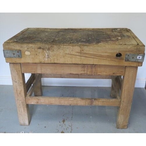 A pine butchers block on stand, 81cm tall x 109cm x 64cm (in...