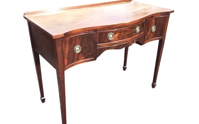 A regency style serpentine fronted mahogany dressing table by Charles...