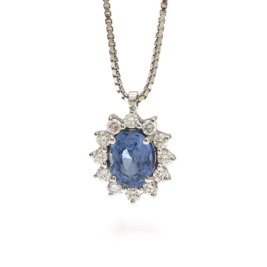 A sapphire and diamond necklace set with an oval-cut sapphire weighing app. 2.13 ct. encircled by numerous brilliant-cut diamonds, mounted in 18k white gold.