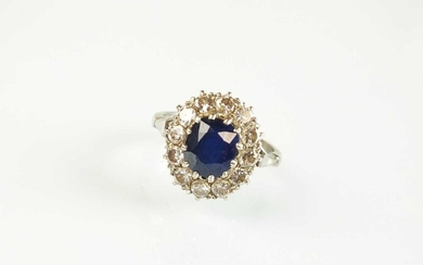 A sapphire and diamond oval cluster ring