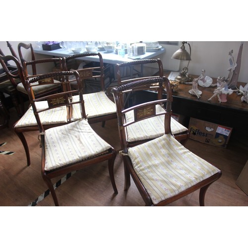 A set of six Regency style mahogany and stained beech dining...