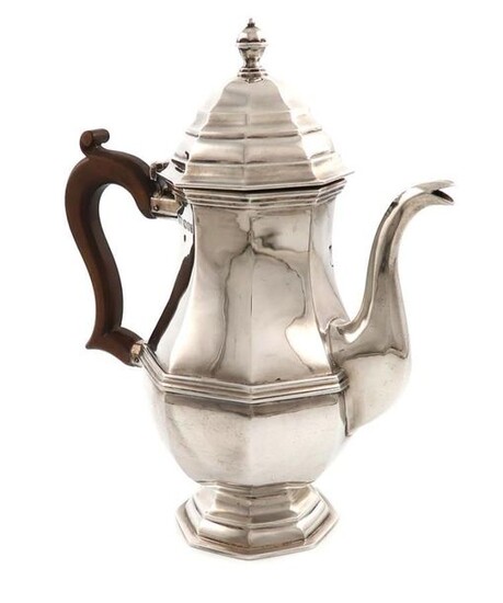 A silver coffee pot, by Carrington and Co., London 1919, octagonal baluster form, scroll handle, domed hinged cover, on a raised octagonal foot, height 23.3cm, approx. weight 22.8oz.