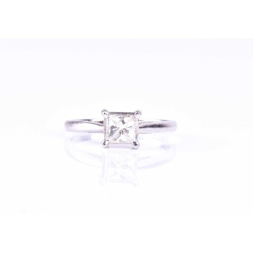 A square brilliant-cut diamond ring, set with a single stone...