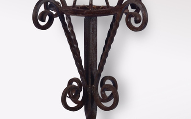 A wrought iron floor candlestick, 20th century.