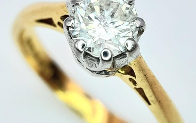 AN 18K YELLOW GOLD DIAMOND SOLITAIRE RING - 0.65CT....