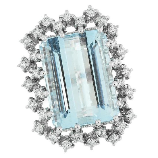 AN AQUAMARINE AND DIAMOND RING set with an emerald cut